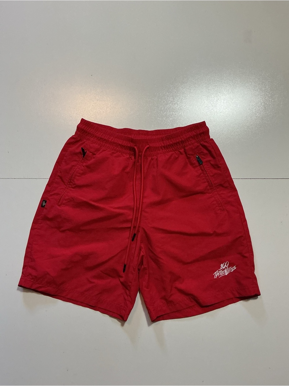 100 Thieves 10T Red Nylon Drawstring 7" Inseam Embroidered Logo Shorts